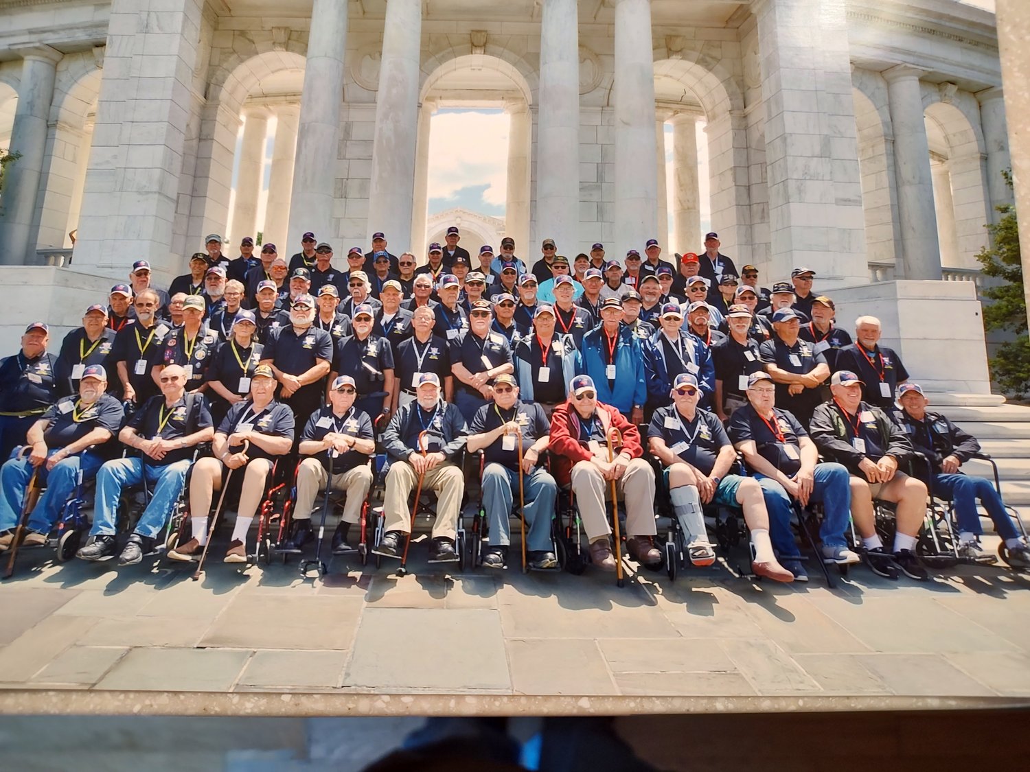 Veterans attending the June 18 Honor Flight assembled for group photo at Arlington National Cemetery.